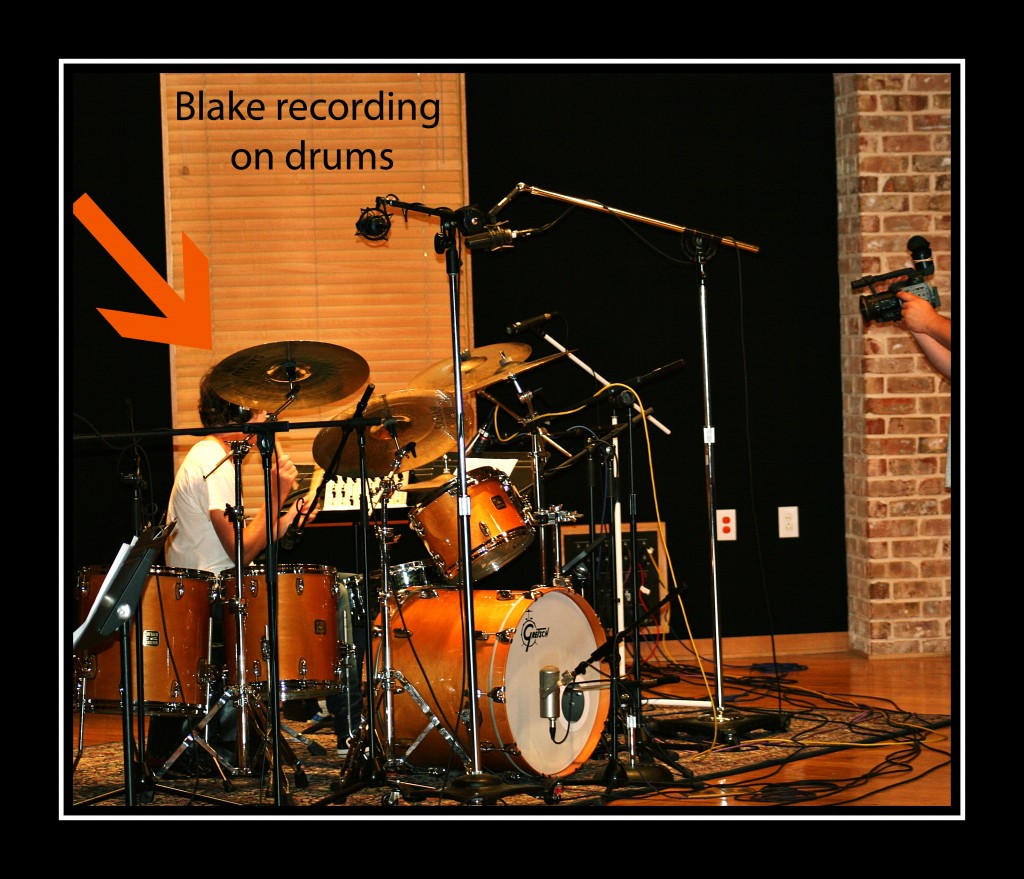 Blake on drums in studio arrow framed